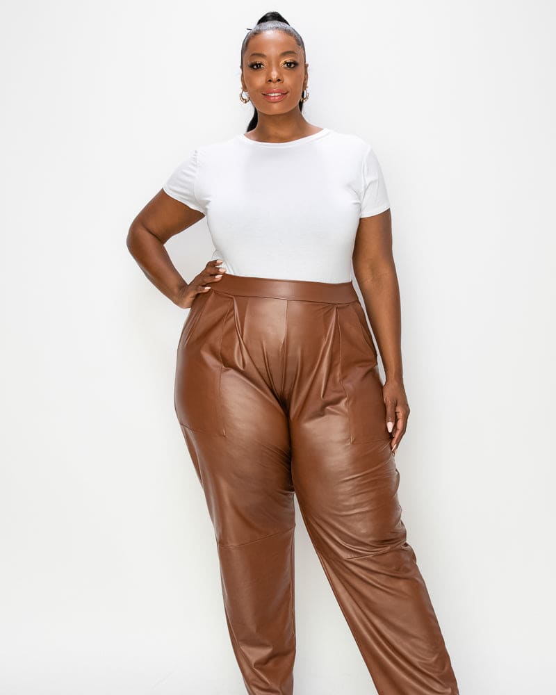 Front of a model wearing a size 1X Elise Vegan Leather Pocket Pants in Camel by L I V D. | dia_product_style_image_id:240552